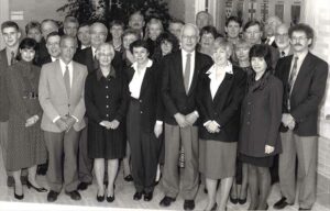 Black and white photo of group of men and women